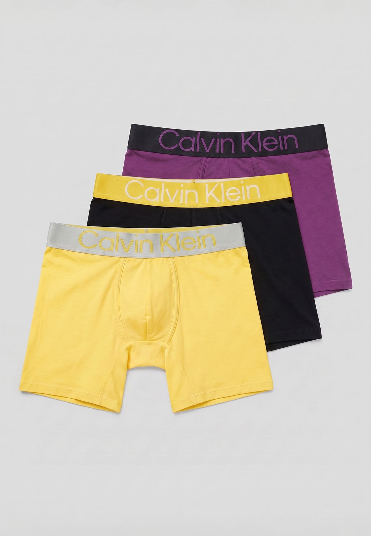 Pack de 3 boxers longs Calvin Klein — exemple d'assortiment : jaune, noir et violet